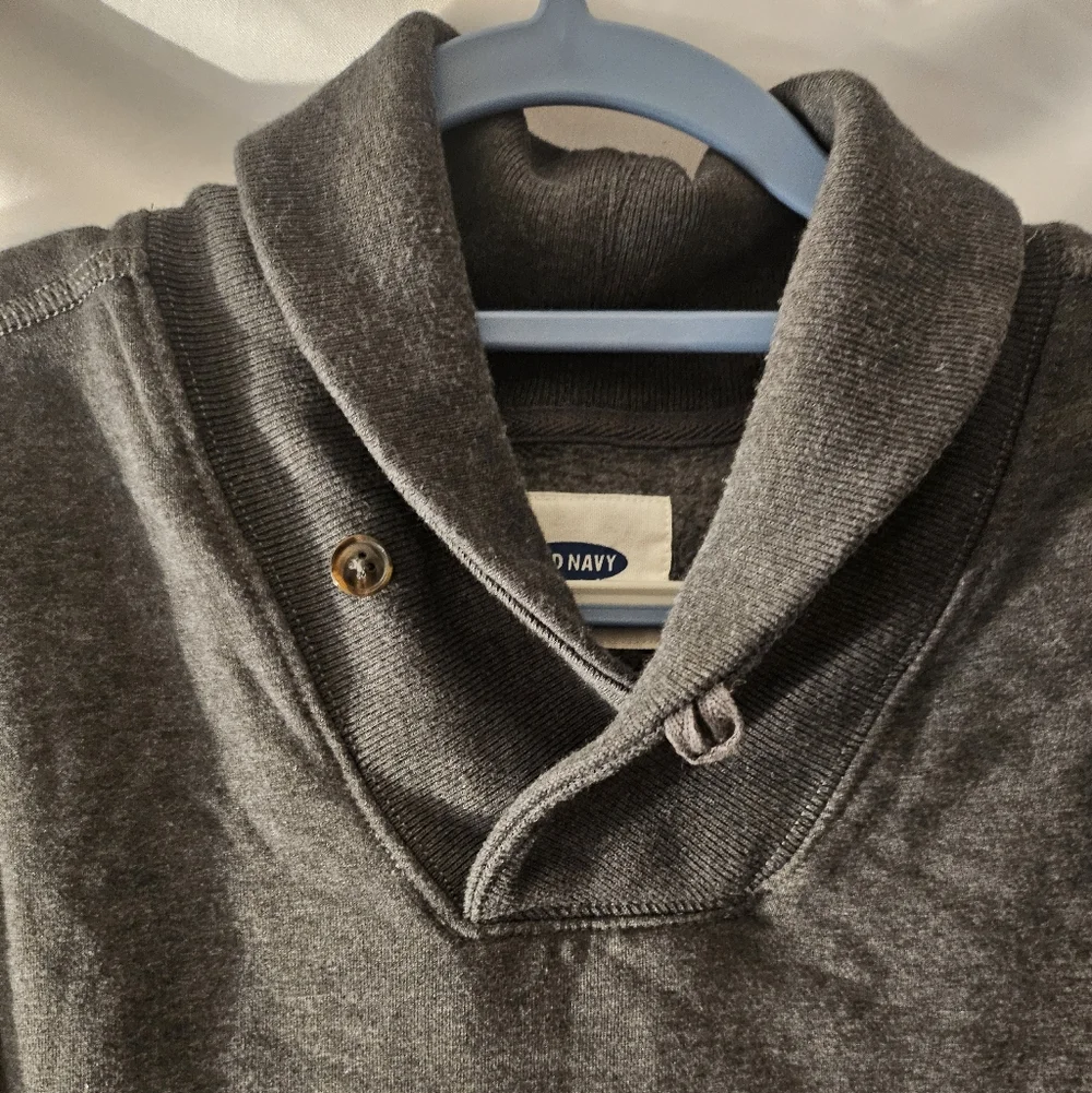 Old Navy shawl‎ collar pullover sweatshirt in a heathered charcoal gray.